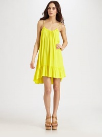 Backed by adjustable feather-adorned ties and a scoopback, this ladylike go-to has allover shirring and a hi-low ruffle hem. ScoopneckSpaghetti strapsHi-low ruffle hemScoopback with feather-detail self tiesAbout 21 from natural waistRayonDry cleanMade in USA of imported fabricModel shown is 5'10 (177cm) wearing US size Small. Backed by adjustable feather-adorned ties and a scoopback, this ladylike go-to has allover shirring and a hi-low ruffle hem. ScoopneckSpaghetti strapsHi-low ruffle hemScoopback with feather-detail self tiesAbout 21 from natural waistRayonDry cleanMade in USA of imported fabricModel shown is 5'10 (177cm) wearing US size Small.