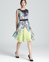 A vibrant, modern print glows with pops of neon and crisp pleats. From BCBGMAXAZRIA.