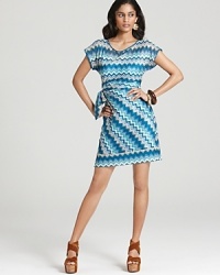 A retro-inspired zig-zag pattern enlivens this Julie Dillon dress, finished with a chic faux-wrap skirt. A retro-inspired zig-zag pattern enlivens this Julie Dillon dress, finished with a chic faux-wrap skirt.