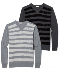 DKNY Jeans updates a V-neck sweater silhouette by printing stripes across the torso. DKNY Jeans updates a V-neck sweater silhouette by printing stripes across the torso.