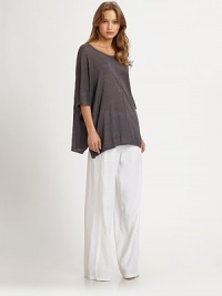 Soft linen boatneck with three-quarter dolman sleeves and an emphasized hi-low hem can be paired with fitted jeans or wide-leg pants for a slouchy-chic look. BoatneckDropped shouldersThree-quarter dolman sleevesDraped hi-low hemLinenDry cleanImportedModel shown is 5'10 (177cm) wearing US size Small. Soft linen boatneck with three-quarter dolman sleeves and an emphasized hi-low hem can be paired with fitted jeans or wide-leg pants for a slouchy-chic look. BoatneckDropped shouldersThree-quarter dolman sleevesDraped hi-low hemLinenDry cleanImportedModel shown is 5'10 (177cm) wearing US size Small.
