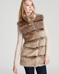 Tiers of faux leather and faux fur mix for a sumptuous, eco-friendly look on this Via Spiga vest, the perfect way to add decadence to any fall look. Tiers of faux leather and faux fur mix for a sumptuous, eco-friendly look on this Via Spiga vest, the perfect way to add decadence to any fall look.