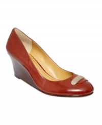 Drop hints of style everywhere you step. Nine West's Getablue wedge pumps are decorated with a metallic accent that stretches across the vamp. Drop hints of style everywhere you step. Nine West's Getablue wedge pumps are decorated with a metallic accent that stretches across the vamp.
