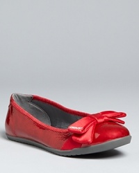 Satin bows on shining patent atop athletic-inspired bottoms keep these DKNY ballet flats in their own class. Satin bows on shining patent atop athletic-inspired bottoms keep these DKNY ballet flats in their own class.