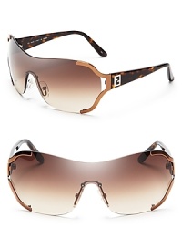 Fendi's shield logo sunglasses are futuristic and fashion-forward in sultry shades of bronze and gold. Fendi's shield logo sunglasses are futuristic and fashion-forward in sultry shades of bronze and gold.
