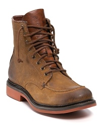 Distressed suede lends a rugged appeal to Frye's sturdily-built Wallace boot, outfitted with leather lace up closure and stacked hard rubber heel. Distressed suede lends a rugged appeal to Frye's sturdily-built Wallace boot, outfitted with leather lace up closure and stacked hard rubber heel.