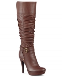 Unbelievably tall and completely cute. The Dorbii wide-calf platform dress boots by G by GUESS feature ruched detail along the shaft and a super high heel. Unbelievably tall and completely cute. The Dorbii wide-calf platform dress boots by G by GUESS feature ruched detail along the shaft and a super high heel.