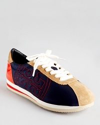 Embroidered with Tory's signature logo, these casual-cool sneakers are going places. Embroidered with Tory's signature logo, these casual-cool sneakers are going places.