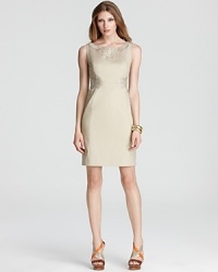 Intricate embroidery slithers across this Elie Tahari dress for a textured python print that pops from the beige silhouette. Pair with nude pumps for a racy take on neutrals. Intricate embroidery slithers across this Elie Tahari dress for a textured python print that pops from the beige silhouette. Pair with nude pumps for a racy take on neutrals.