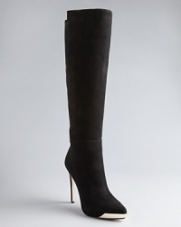 Rachel Roy kicks basic black suede high heel boots up a notch with futuristic metal toe accents, playing up must-have pointed toes. Rachel Roy kicks basic black suede high heel boots up a notch with futuristic metal toe accents, playing up must-have pointed toes.