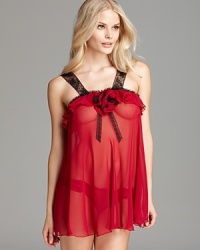 End late nights in this fanciful, sheer babydoll and matching bikini from Flora Nikrooz. End late nights in this fanciful, sheer babydoll and matching bikini from Flora Nikrooz.