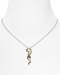 This Judith Jack pendant necklace brings this season's serpentine inspiration to your neckline, cast in 14-karat gold with bold black stones. This Judith Jack pendant necklace brings this season's serpentine inspiration to your neckline, cast in 14-karat gold with bold black stones.