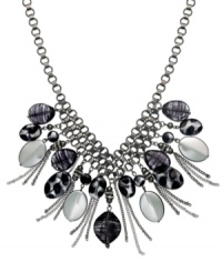 Go wild with this safari-inspired look from Style&co. Chains and animal printed beads dangle from mixed metal silver-tone chain. Approximate length: 18 inches + 2 inch extender. Go wild with this safari-inspired look from Style&co. Chains and animal printed beads dangle from mixed metal silver-tone chain. Approximate length: 18 inches + 2 inch extender.