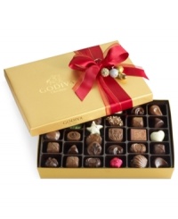 Donned with a red bow with elegantly placed baubles, this classic collection of Godiva chocolates makes a perfectly sweet and irresistible gift this season. Donned with a red bow with elegantly placed baubles, this classic collection of Godiva chocolates makes a perfectly sweet and irresistible gift this season.