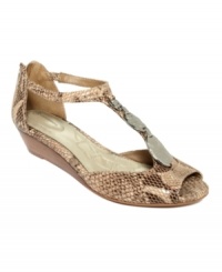 Giani Bernini's Elya pumps feature cute flat metal accents on the vamp and an elastic strap on the side for comfort.. Giani Bernini's Elya pumps feature cute flat metal accents on the vamp and an elastic strap on the side for comfort..