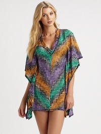 A vibrant coverup with a seductive neckline and feminine fit.Deep v-neckKimono sleevesPull-on styleRayon/polyester/cottonDry cleanMade in Italy of imported fabric A vibrant coverup with a seductive neckline and feminine fit.Deep v-neckKimono sleevesPull-on styleRayon/polyester/cottonDry cleanMade in Italy of imported fabric