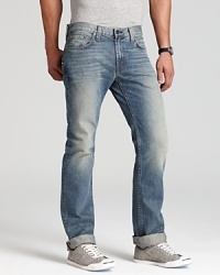 In a light, faded wash, these J Brand jeans lend a laid-back look with a slim, straight leg fit. In a light, faded wash, these J Brand jeans lend a laid-back look with a slim, straight leg fit.