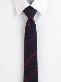 A multi-textured weave with ribbon stripes of color on pure Italian silk.SilkDry cleanMade in Italy A multi-textured weave with ribbon stripes of color on pure Italian silk.SilkDry cleanMade in Italy