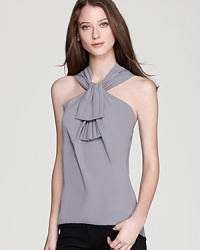 Rolling ruffles accent a fluid T Tahari blouse for an effortlessly luxe look. Team with a blazer for your 9-to-5, then dawn solo for all your after-hours adventures. Rolling ruffles accent a fluid T Tahari blouse for an effortlessly luxe look. Team with a blazer for your 9-to-5, then dawn solo for all your after-hours adventures.