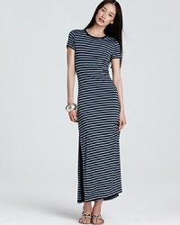 Cut a graphic silhouette in this MICHAEL Michael Kors maxi dress sharply styled with shoulder-to-shoe stripes. Punctuate the optic silhouette with acid-bright accents. Cut a graphic silhouette in this MICHAEL Michael Kors maxi dress sharply styled with shoulder-to-shoe stripes. Punctuate the optic silhouette with acid-bright accents.