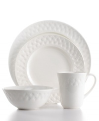 White porcelain dinnerware and dishes embossed with a woven basket motif serves casual meals with quaint country charm. A radiant glaze makes this 16-piece set shine in any setting. From Martha Stewart Collection.