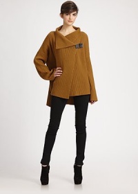 Casual-cool, oversized wool sweater with a leather snap detail, slash pockets and lengthy silhouette that can be perfectly paired with leather leggings and a skinny belt. Oversized collarDropped shouldersLeather snap detailLong sleevesSlash pocketsAbout 29 from shoulder to hemWoolDry cleanImportedModel shown is 5'10 (177cm) wearing US size XSmall/Small. Casual-cool, oversized wool sweater with a leather snap detail, slash pockets and lengthy silhouette that can be perfectly paired with leather leggings and a skinny belt. Oversized collarDropped shouldersLeather snap detailLong sleevesSlash pocketsAbout 29 from shoulder to hemWoolDry cleanImportedModel shown is 5'10 (177cm) wearing US size XSmall/Small.