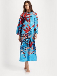 A bold abstract print covers this long silhouette, perfect for layering with your favorite pieces. Pull-over styleMandarin collarLong sleevesAbout 52 from shoulder to hemPolyesterMachine washImported