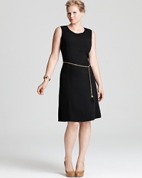A metallic belt electrifies a black Calvin Klein Plus dress, touting a fit-and-flare silhouette for a modern feminine statement. Keep the style strong with sleek accents. A metallic belt electrifies a black Calvin Klein Plus dress, touting a fit-and-flare silhouette for a modern feminine statement. Keep the style strong with sleek accents.