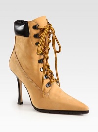 Gunmetal rings and bicolor laces top this point toe silhouette of buttery suede with rich leather trim. Stacked heel, 4 (100mm)Suede and leather upperPoint toeLeather liningRubber solePadded insoleMade in Italy Gunmetal rings and bicolor laces top this point toe silhouette of buttery suede with rich leather trim. Stacked heel, 4 (100mm)Suede and leather upperPoint toeLeather liningRubber solePadded insoleMade in Italy