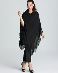 Transition into the new season by topping off your look with a lush layer. This C by Bloomingdale's Plus poncho is decorated by boho-chic fringe for the perfect touch of bohemian-chic. Transition into the new season by topping off your look with a lush layer. This C by Bloomingdale's Plus poncho is decorated by boho-chic fringe for the perfect touch of bohemian-chic.