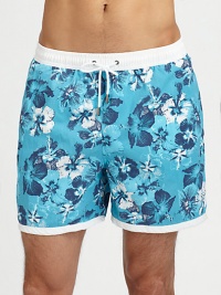 Tropical style hits the beach in a bold floral print with a breezy white waistband.Elastic drawstring waistBack patch pocketPolyamidePolyester liningMachine washImported Tropical style hits the beach in a bold floral print with a breezy white waistband.Elastic drawstring waistBack patch pocketPolyamidePolyester liningMachine washImported