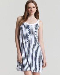 An adorable striped sleeveless knit gown with scalloped edge lace trim and flower shaped buttons. An adorable striped sleeveless knit gown with scalloped edge lace trim and flower shaped buttons.