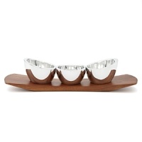 Please the friendly crowd with three different but equally delicious condiments, each in their own signature metal bowls on this cherry wood sleigh. Easy to transport to other corners of the party, this handcrafted gem has all the makings of a great time.