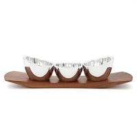 Please the friendly crowd with three different but equally delicious condiments, each in their own signature metal bowls on this cherry wood sleigh. Easy to transport to other corners of the party, this handcrafted gem has all the makings of a great time. Please the friendly crowd with three different but equally delicious condiments, each in their own signature metal bowls on this cherry wood sleigh. Easy to transport to other corners of the party, this handcrafted gem has all the makings of a great time.