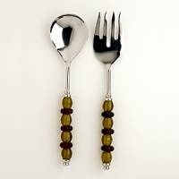 This stylish serving set combines amber and ruby glass handles with exquisitely hand-polished metal. This stylish serving set combines amber and ruby glass handles with exquisitely hand-polished metal.