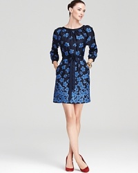 Dainty blossoms spring from the sleek silhouette of this Vineyard Vines dress, cinched with a silk belt for pure feminine charm. Up the style factor with color-pop heels. Dainty blossoms spring from the sleek silhouette of this Vineyard Vines dress, cinched with a silk belt for pure feminine charm. Up the style factor with color-pop heels.