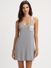 A lace trimmed style in a classic silhouette. Scoopneck Sleeveless Lace left breast pocket About 33 from shoulder to hem 95% modal/5% spandex Machine wash Imported A lace trimmed style in a classic silhouette. Scoopneck Sleeveless Lace left breast pocket About 33 from shoulder to hem 95% modal/5% spandex Machine wash Imported