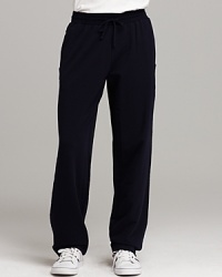 Sweat pants with two front pockets and one back pocket. Unfinished seam detail on sides. Elasticized waist with drawstring closure. Sweat pants with two front pockets and one back pocket. Unfinished seam detail on sides. Elasticized waist with drawstring closure.