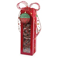 Beautifully wrapped in a holiday motif complete with a Christmas tree ornament, these chocolate-covered confections are a mouthwatering delight - perfect for gift giving. Beautifully wrapped in a holiday motif complete with a Christmas tree ornament, these chocolate-covered confections are a mouthwatering delight - perfect for gift giving.