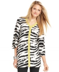 This chic tunic from Alfani features a bold animal print that's highlighted by a flash of contrasting trim at the neck and center front. This chic tunic from Alfani features a bold animal print that's highlighted by a flash of contrasting trim at the neck and center front.