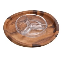 Ideal for a party offering crudites or a casual supper of burgers with lettuce leaves presented, this set combines an acacia-wood tray and a three-section crystal condiment bowl. Artisanal and artistic, the tray features a rim of subtly differing heights and an equally subtle diameter, testament to the inspiration that designer Sean O'Hara drew from a butterfly. Acacia, a dense, durable hardwood, glows with warmth and enthralls with finely patterned grain of varying shades. Naturally resinous, acacia will not absorb stains or odors. The condiment bowl is made of solid, sparkling full-lead Nambé crystal hand-crafted in the traditional way by the finest European artisans according to a 300-year-old process. Both tray and bowl should be hand washed in warm, soapy water. Ideal for a party offering crudites or a casual supper of burgers with lettuce leaves presented, this set combines an acacia-wood tray and a three-section crystal condiment bowl. Artisanal and artistic, the tray features a rim of subtly differing heights and an equally subtle diameter, testament to the inspiration that designer Sean O'Hara drew from a butterfly. Acacia, a dense, durable hardwood, glows with warmth and enthralls with finely patterned grain of varying shades. Naturally resinous, acacia will not absorb stains or odors. The condiment bowl is made of solid, sparkling full-lead Nambé crystal hand-crafted in the traditional way by the finest European artisans according to a 300-year-old process. Both tray and bowl should be hand washed in warm, soapy water.