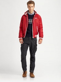 A contemporary interpretation of a classic varsity jacket is crafted from sleek, resilient nylon with contrast piping and chest logo detail.Zip frontStand collarWaist zip pocketsBanded cuffs and hemFully linedAbout 26 from shoulder to hemPolyesterMachine washImportedOUR FIT MODEL RECOMMENDS ordering true size. A contemporary interpretation of a classic varsity jacket is crafted from sleek, resilient nylon with contrast piping and chest logo detail.Zip frontStand collarWaist zip pocketsBanded cuffs and hemFully linedAbout 26 from shoulder to hemPolyesterMachine washImportedOUR FIT MODEL RECOMMENDS ordering true size.