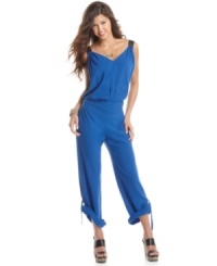 Roll tab cuffs makes this jumpsuit from Reign a novel pick in fashion's one-piece craze! Pair it with platform heels for a look that's trend-forward! Roll tab cuffs makes this jumpsuit from Reign a novel pick in fashion's one-piece craze! Pair it with platform heels for a look that's trend-forward!