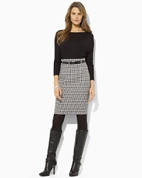 A classic houndstooth skirt is paired with a relaxed fitting bodice on this timeless Lauren by Ralph Lauren twofer dress. A classic houndstooth skirt is paired with a relaxed fitting bodice on this timeless Lauren by Ralph Lauren twofer dress.