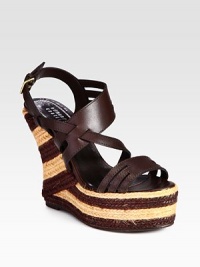 Rich, intertwining leather straps set on a striped espadrille wedge and platform. Hemp wedge, 5 (125mm)Hemp platform, 2 (50mm)Compares to a 3 heel (75mm)Leather upperLeather lining and solePadded insoleMade in SpainOUR FIT MODEL RECOMMENDS ordering true whole size; ½ sizes should order the next whole size up. Rich, intertwining leather straps set on a striped espadrille wedge and platform. Hemp wedge, 5 (125mm)Hemp platform, 2 (50mm)Compares to a 3 heel (75mm)Leather upperLeather lining and solePadded insoleMade in SpainOUR FIT MODEL RECOMMENDS ordering true whole size; ½ sizes should order the next whole size up.