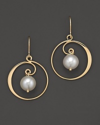 Gleaming freshwater pearls shine from the heart of 14K. yellow gold swirls. Gleaming freshwater pearls shine from the heart of 14K. yellow gold swirls.