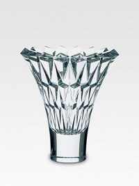A beautiful crystal vase is handcrafted with a smooth base and diamond-cut facets along the wide, open neck. From the Tornado Collection Full-lead crystal 10 high Hand wash Made in France 