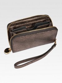 Trim and elegant, this zip-around design of glistening metallic goatskin is just the right size to hold your phone, a credit card, a little cash and a key or two so it's perfect for a pared-down night on the town.HandcraftedZip-around designDetachable wrist strapCell phone pocketTwo inside card slotsInside currency pocketInside zip change pocket5½L X 3¼WImported Trim and elegant, this zip-around design of glistening metallic goatskin is just the right size to hold your phone, a credit card, a little cash and a key or two so it's perfect for a pared-down night on the town.HandcraftedZip-around designDetachable wrist strapCell phone pocketTwo inside card slotsInside currency pocketInside zip change pocket5½L X 3¼WImported
