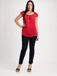It's all about subtle sophistication. This peasant top features delicate embroidery and a relaxed-yet-flattering fit you will adore.Self-tie detail at necklineCap sleevesEmbroidered detailsAbout 30 from shoulder to hemRayonMachine washImported It's all about subtle sophistication. This peasant top features delicate embroidery and a relaxed-yet-flattering fit you will adore.Self-tie detail at necklineCap sleevesEmbroidered detailsAbout 30 from shoulder to hemRayonMachine washImported