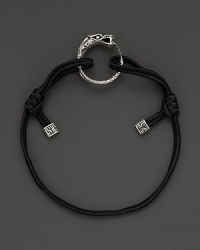 Eastern elements inform John Hardy's dragon head bracelet. It features a cotton cord band with an adjustable sliding closure. Eastern elements inform John Hardy's dragon head bracelet. It features a cotton cord band with an adjustable sliding closure.